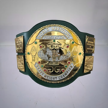 Front view of the iconic 1980s WWF Championship Belt with green strap, famously held by Hulk Hogan during his early title reign.