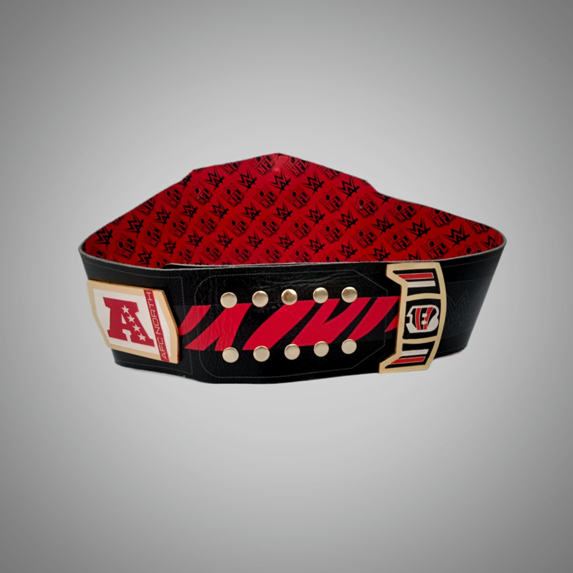 Detailed view of the Cincinnati Bengals WWE Championship Belt, featuring embossed logos and a sleek design.