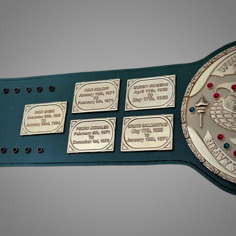 Close-up of the Hulk Hogan-era WWF belt with fine detailing in the golden center plate and strap texture.