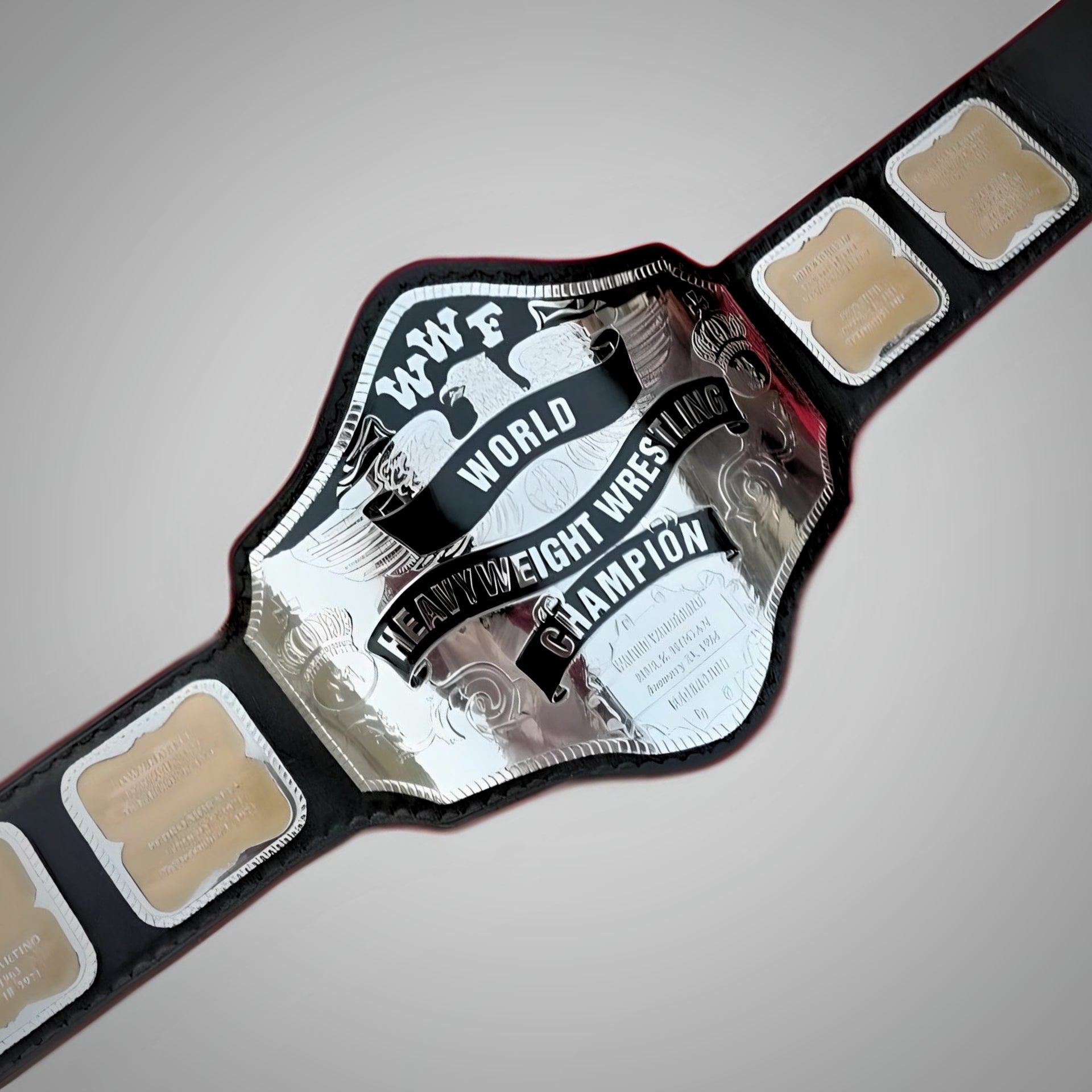 Intricate etching on Hulk Hogan’s 1985 WWF belt, capturing classic iconography and craftsmanship.