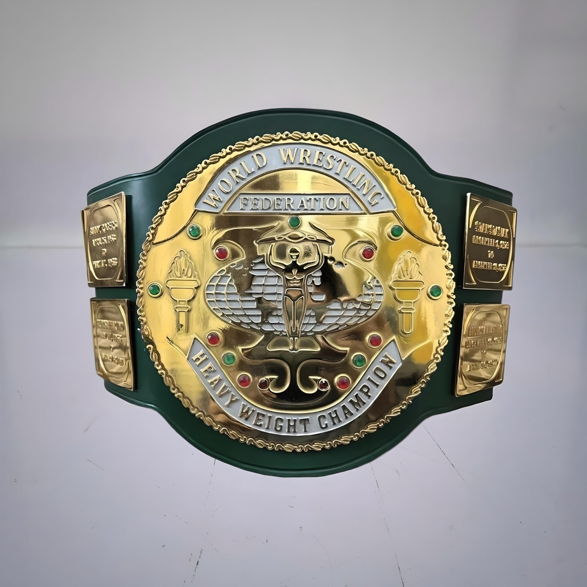 Front view of the iconic 1980s WWF Championship Belt with green strap, famously held by Hulk Hogan during his early title reign.