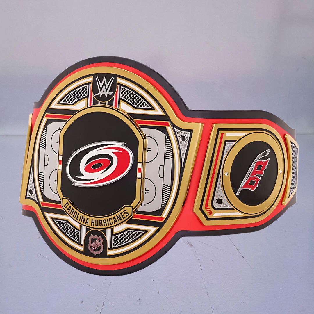 Close-up of the Carolina Hurricanes WWE Championship Belt, showcasing red, black, and white accents.