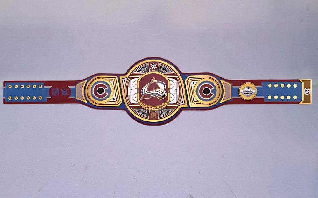 Detailed view of the WWE Championship Belt for the Colorado Avalanche, featuring embossed logos and a polished finish.