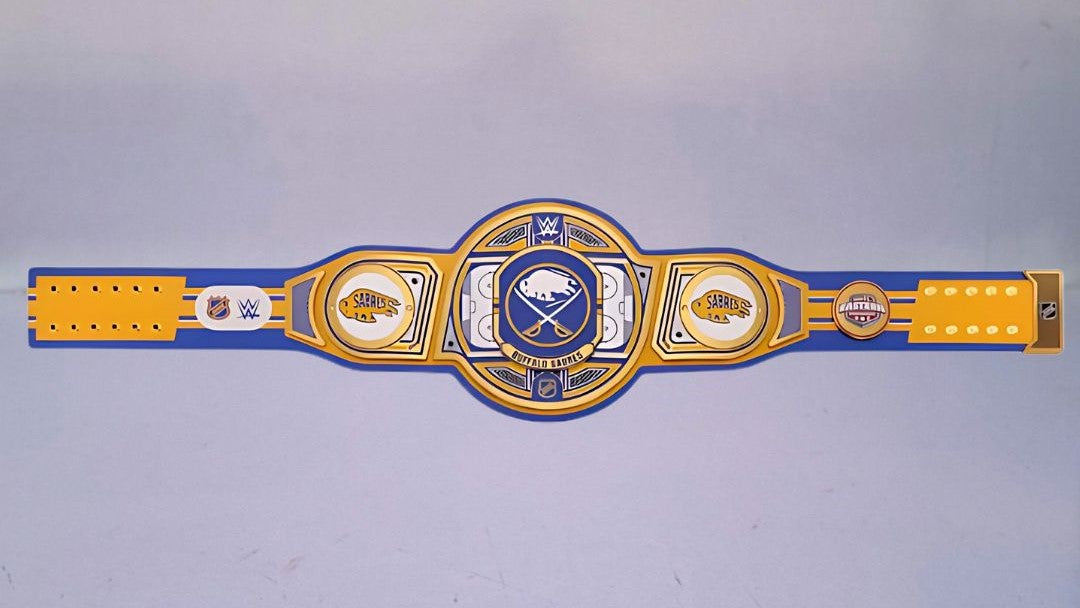 Detailed view of the Buffalo Sabres WWE Championship Belt, featuring embossed logos and a polished finish.