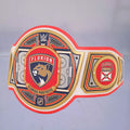 Close-up of the Florida Panthers WWE Championship Belt, showcasing red, white, and blue accents.