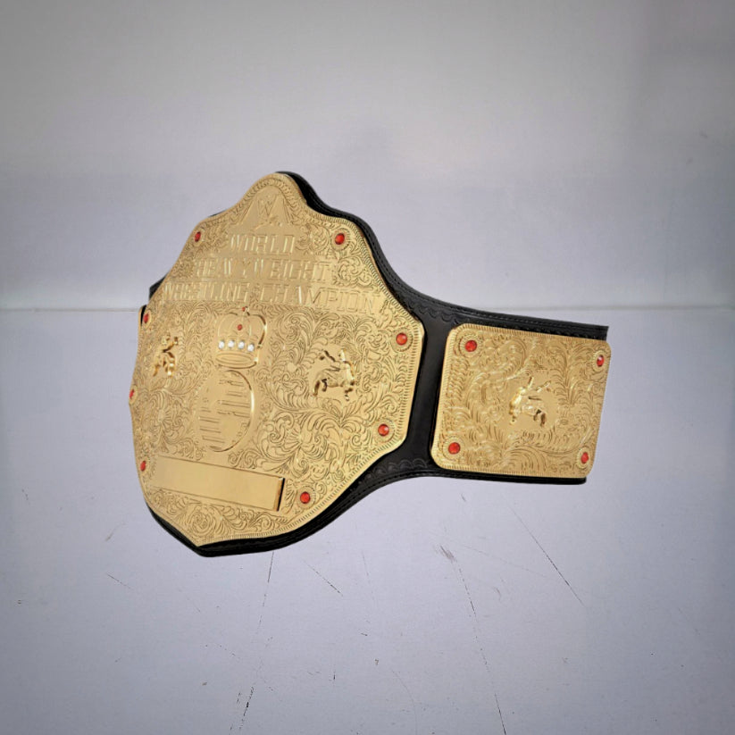 WWE World Heavyweight Championship Belt 2002 with gold-plated details, a crown, and a globe, known as the Big Gold Belt.