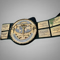 Close-up of the Hulk Hogan-era WWF belt with fine detailing in the golden center plate and strap texture.