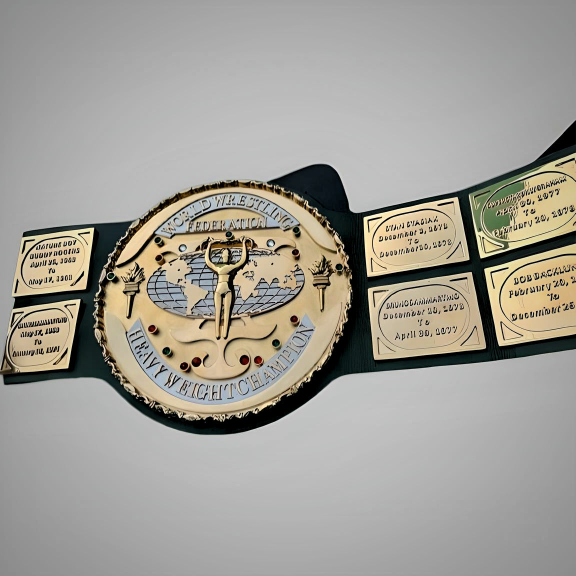 Close-up of the Hulk Hogan-era WWF belt with fine detailing in the golden center plate and strap texture.